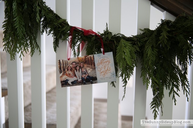 christmas-card-on-stair-garland