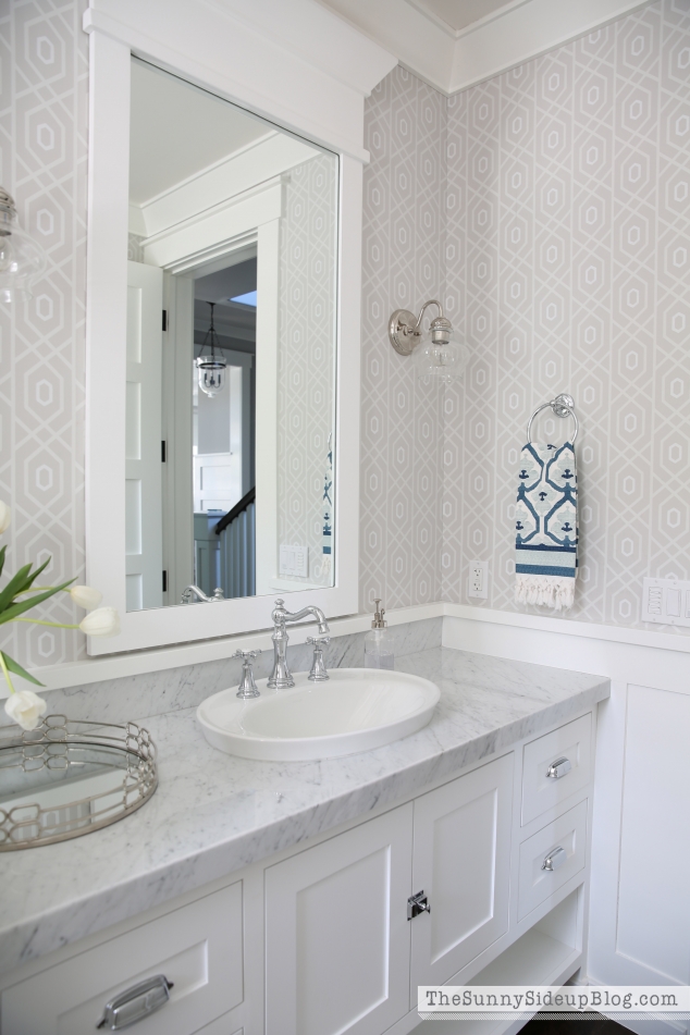 white-molding-around-bathroom-mirror